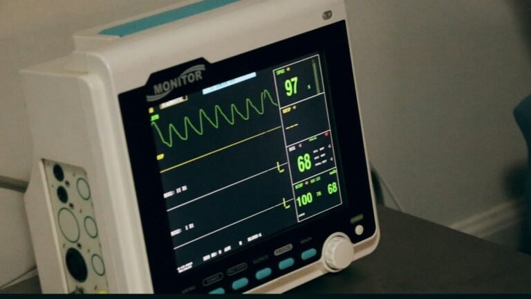 Bedside patient monitor displaying vital signs