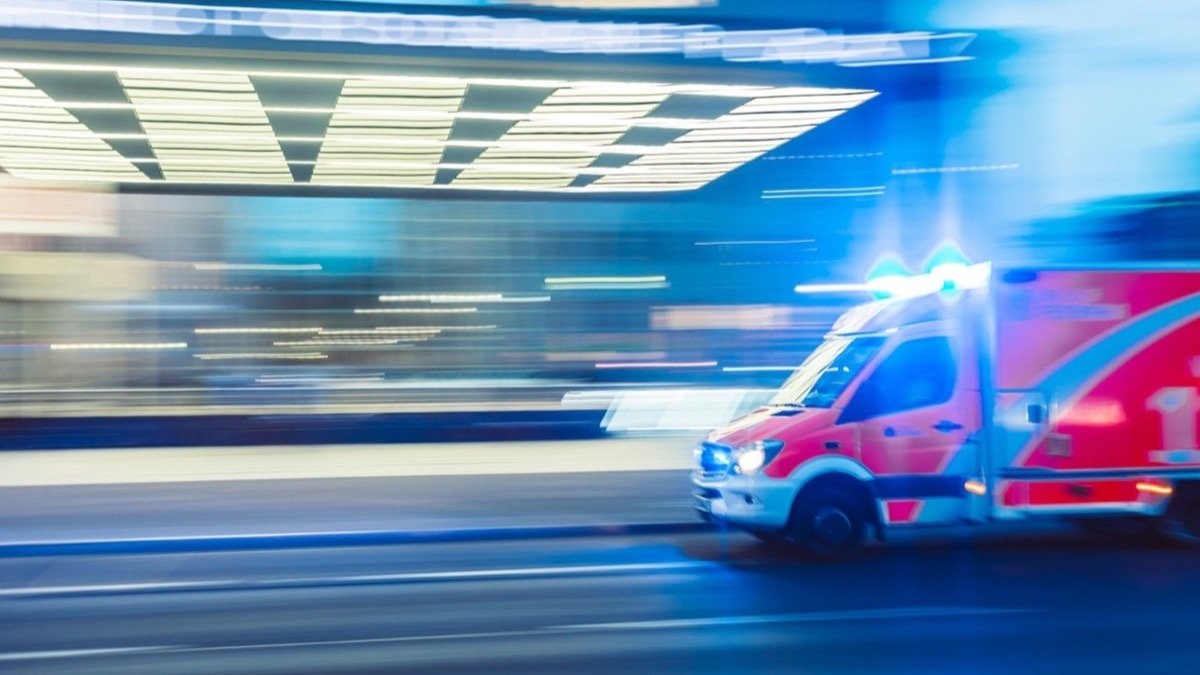 Ambulance passing a hospital entrance